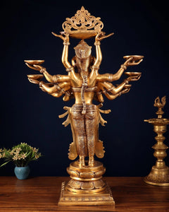 Brass deep lady figurine, back view with ten arms, arched crown and carved body robe