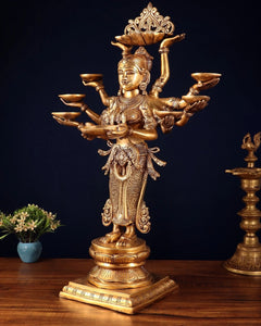Brass deep lady statue with ten arms holding multiple bowl-like hands, detailed face