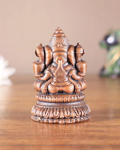 Pure copper Lord Ganesha idol rear view with raised headpiece, 2-inch height