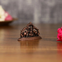 Pure Copper Gajalakshmi idol 1.5 inch, close side view of elephants and ornate arch.