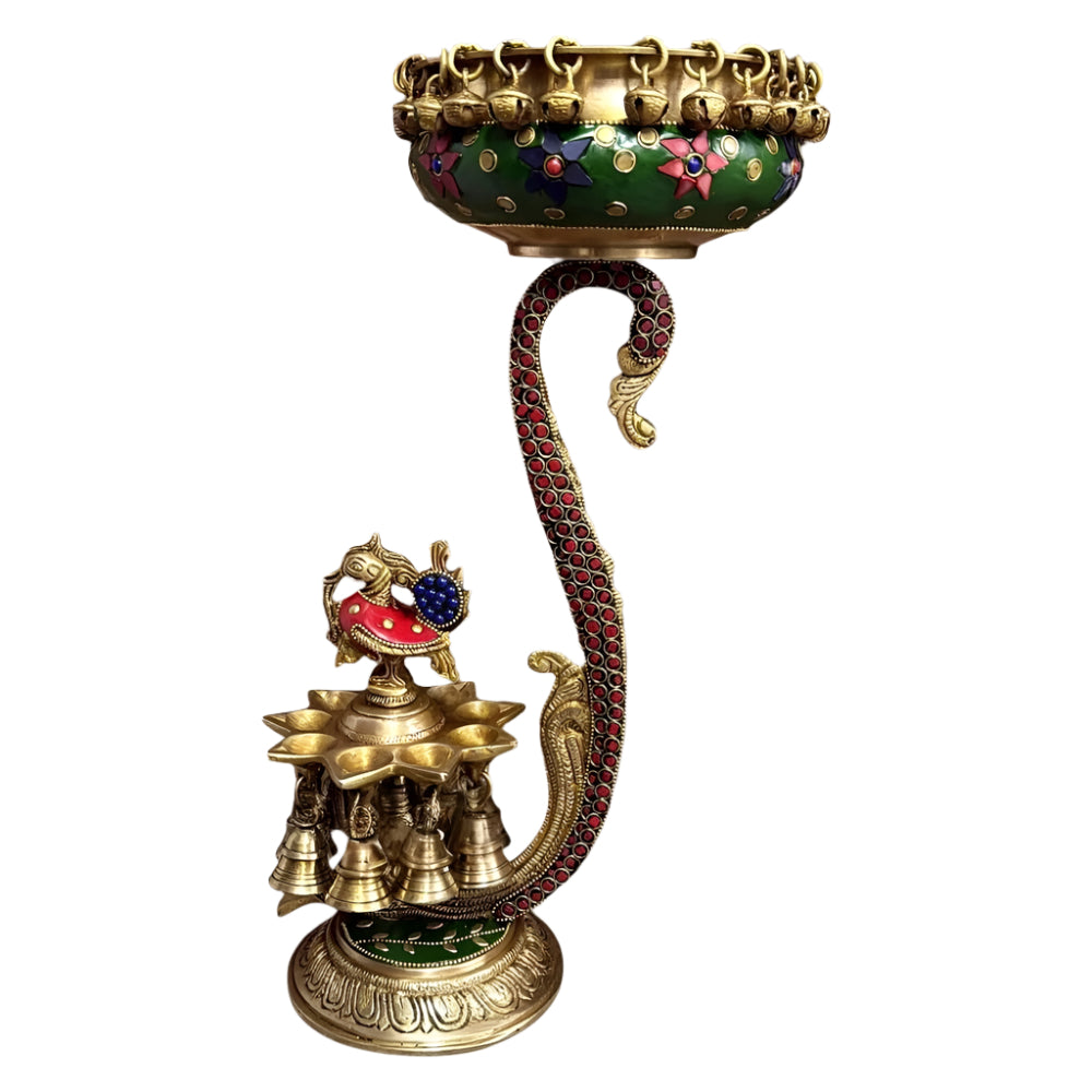 Brass urli diya holder with green enamel rim, peacock figurine and multiple diyas