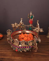 Ashtalakshmi brass urli with diyas, front view with sculpted figures and inner basin