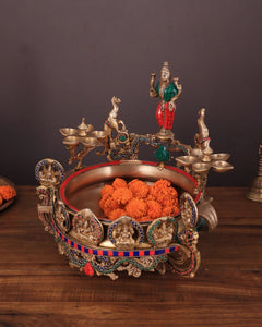 Ashtalakshmi brass urli with diyas, front view with sculpted figures and inner basin
