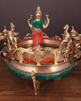 Ashtalakshmi brass urli with diyas, close view of central deity and jeweled rim