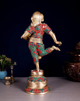 Messing-Pot-Lady-Skulptur von hinten, goldene Figur mit rotem, grünem und blauem Muster