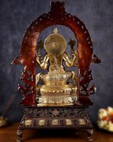 Back view of brass Ganesha statue with dark red-brown halo and engraved base
