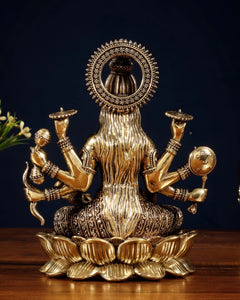 Brass Vijaya Lakshmi idol rear view: long draped back, halo, lotus base, 6.75 in
