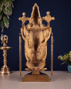 Back view of brass Tirupati Balaji idol with raised crown and hanging arm ornaments