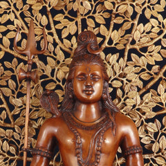 Close-up of Lord Shiva face and chest with trident, bronze tone sculpture