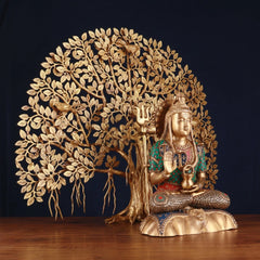 Brass Shiva statue in angled view, trident raised, Kalpavriksha tree roots visible
