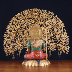Brass Shiva statue rear view, trident and painted robe, Kalpavriksha tree backdrop