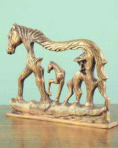 Brass horse wall hanging, side view of connected horses with carved manes and open cutouts