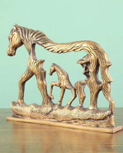 Brass horse wall hanging with textured base and three horses, carved wavy manes