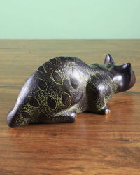 Brass black cat showpiece full length, lying posture with tail folded, detailed paws