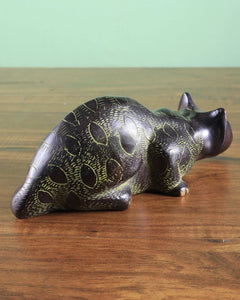 Brass black cat showpiece full length, lying posture with tail folded, detailed paws