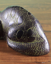 Brass black cat showpiece close-up of side body, brass texture and green-gold inlays