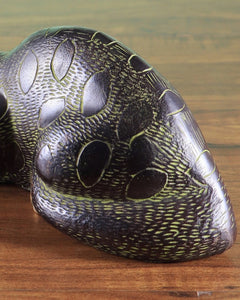 Brass black cat showpiece close-up of side body, brass texture and green-gold inlays