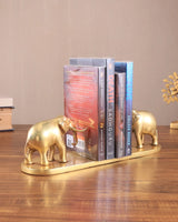 Brass elephant book holder pair supporting books on gold-toned base
