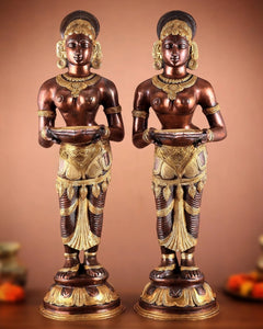 Pure brass lady figurine holding a deepam lamp, full front view, detailed waist and feet