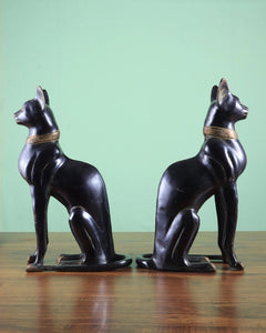 Pair Egyptian black cat figures, side profile, gold collar detail