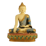 Seated Buddha statue with gold face and blue robe, ornate swirls, round base