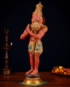 Brass Hanuman idol side view, folded arms in namaskar mudra, ornate attire