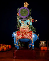 Hand-painted brass Lord Krishna statue rear view, purple halo on cow figure