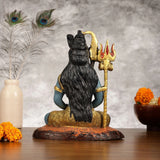 Lord Shiva statue rear view, seated blue figure with black back ornament and gold trident