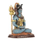 Lord Shiva statue close-up, blue seated body, gold bead ornaments, dark-brown lotus base