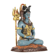 Lord Shiva statue close-up, blue seated body, gold bead ornaments, dark-brown lotus base