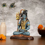 Hand-painted Lord Shiva statue, seated pose with blue arms crossed, tall gold trident