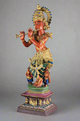Pure brass Krishna statue holding a flute, teal and gold clothing on pedestal