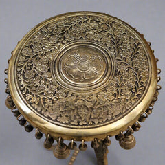 Brass chowki top plate with engraved floral round medallion and hanging bell details