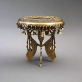 Golden brass chowki pedestal with ornate filigree stand and small bells around top