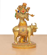 Krishna on cow brass flute sculpture, vivid multicolor meenakari on attire