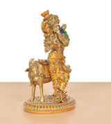 Brass Krishna playing flute on cow, detailed multicolor meenakari finish