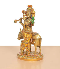 Krishna flute figurine on cow, brass with colorful meenakari patterns