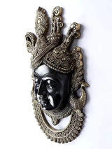 Brass Shrinathji wall hanging showing face profile, crown ornaments, and circular border