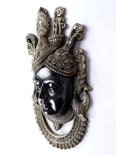 Brass Shrinathji wall hanging showing face profile, crown ornaments, and circular border