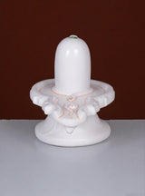 White marble Shiv lingam sculpture on circular base with seated Nandi design