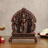 Copper Ram Darbar idol on pedestal with three seated figures and detailed arch