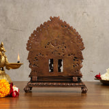 Copper Ram Darbar idol back view with carved halo and cutout detailing on base