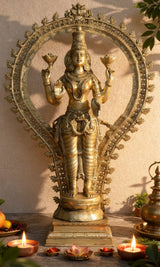 Brass Lakshmi idol with floral aureole halo, four arms holding lotus, 40 inch height