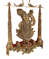Gold-toned brass Shrinath Ji Dwarkadhish statue with bird motifs on top bar