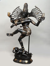 Dancing Shiva Nataraja brass sculpture, three-quarter view with detailed face