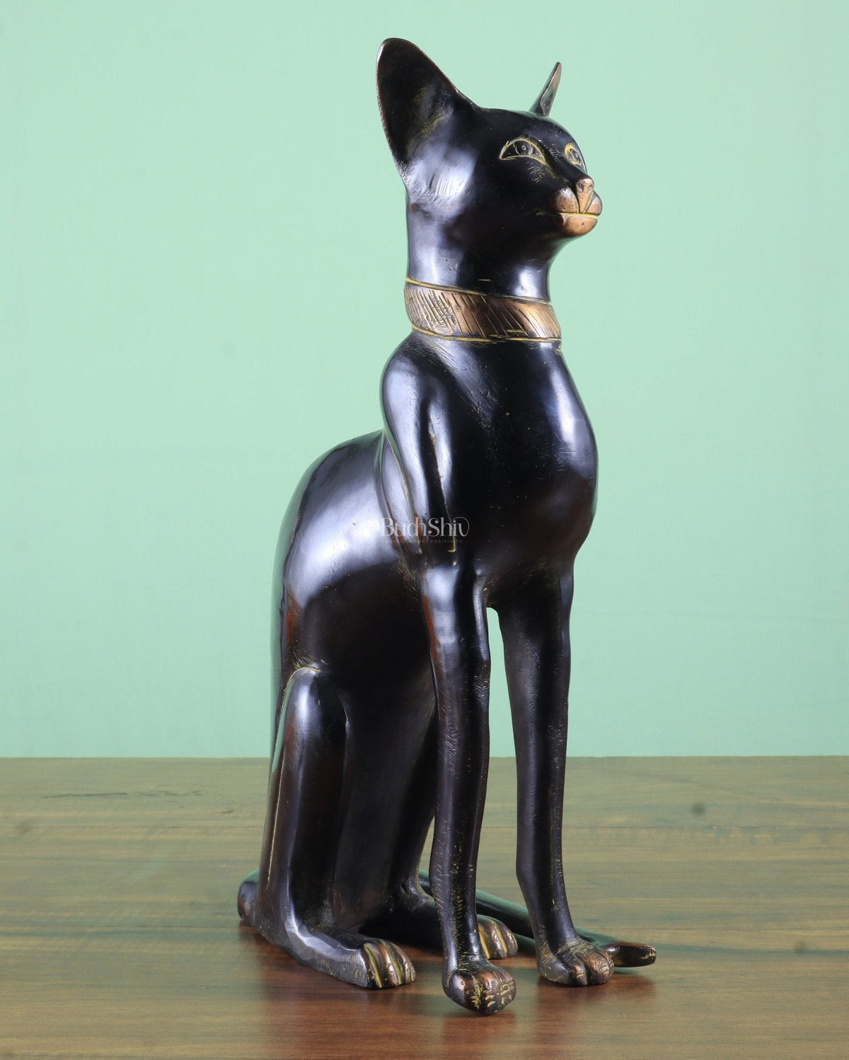 Black Egyptian cat brass showpiece with gold collar, standing side view