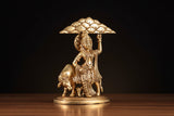 Brass Govardhan Krishna idol, side view with umbrella raised and round base