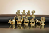 Brass Navagraha set, nine small deity figurines on bases, seated and standing
