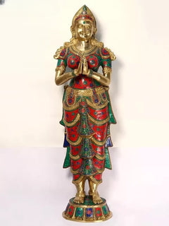 Front view brass Namaste lady sculpture, hands in Anjali mudra, jeweled red and teal outfit