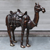 Copper-finish brass camel sculpture, side view, engraved saddle armor, 49 in tall